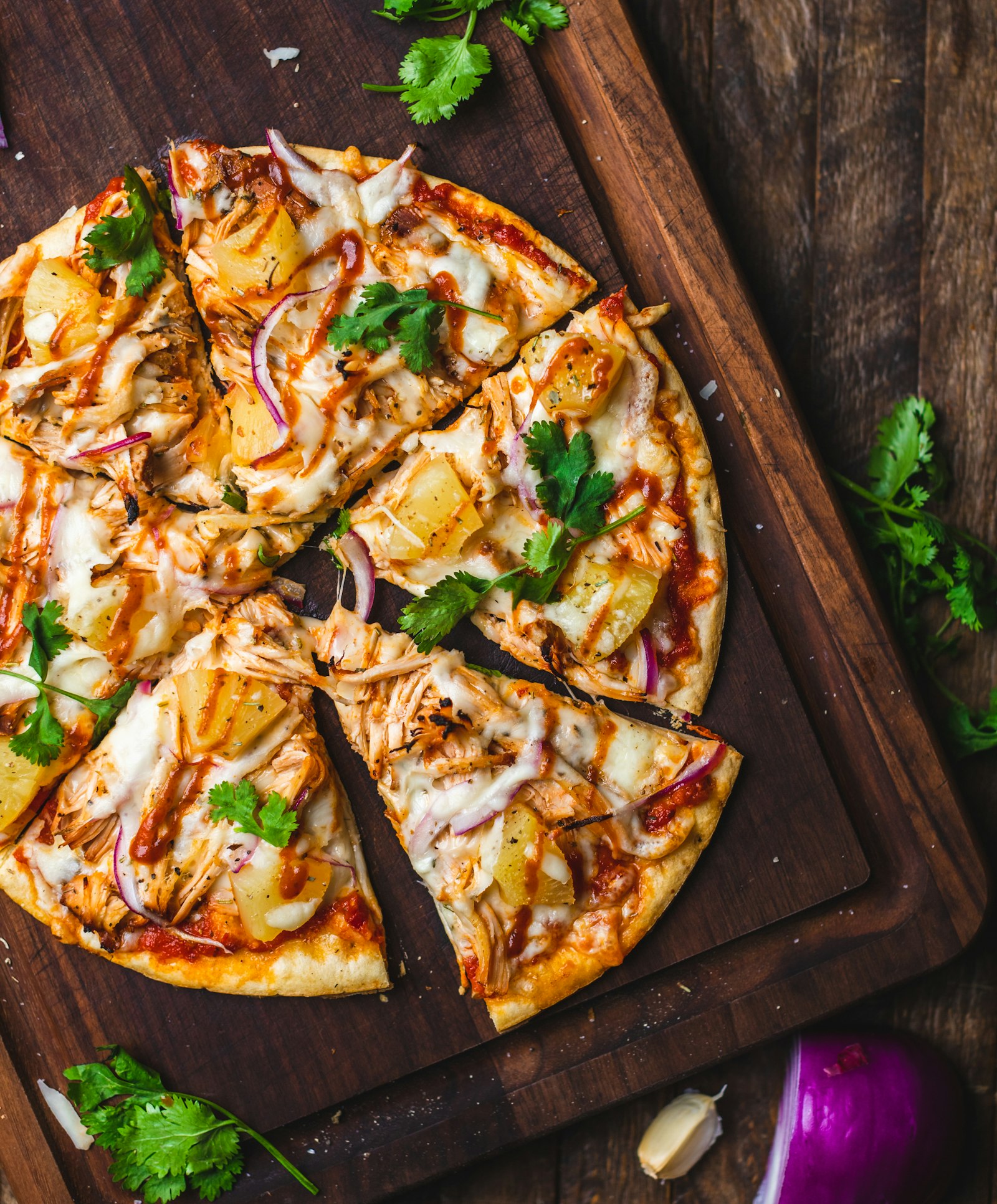 Chicken and ricotta pizza topped with herbs